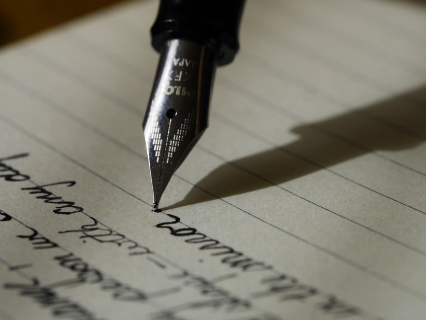 Close-up fountain pen writing notebook